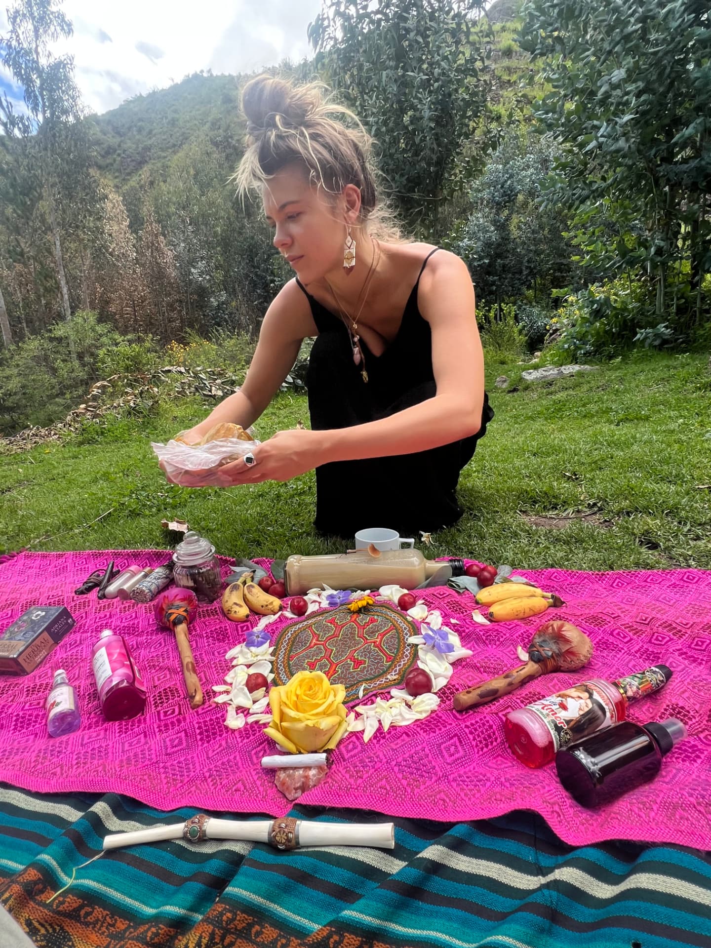Erika Elizabeth preparing a ceremonial offering outdoors
